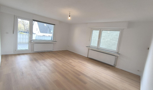 Sanierte Wohnung im Erdgeschoss mit großem Südbalkon und Garage