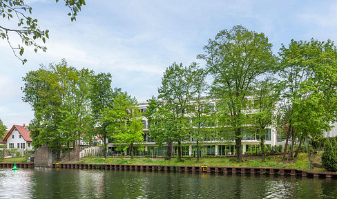 Modern 3-bedroom penthouse apartment with water views, located near Tesla.