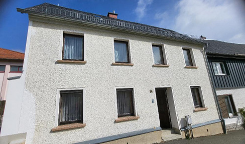 Small terraced house with parking space in a good location with development potential