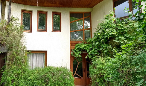 Three-story house built in the anthroposophical architectural style, located in the Waldsiedlung Wildau residential area near Berlin.