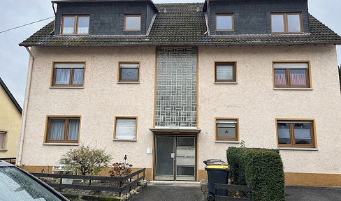 Renovierungsbedürftige Erdgeschosswohnung mit Balkon und Garage in Bingen-Büdesheim