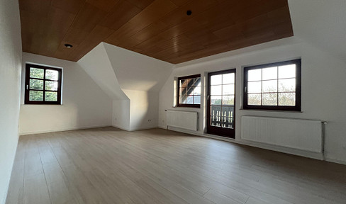 Renovated top-floor apartment with loggia, garden and parking space in a half-timbered ensemble