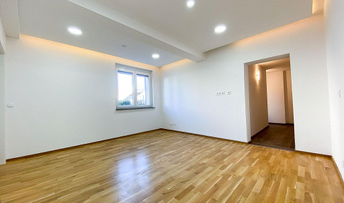 Helle 3-Zimmer-Gartenwohnung mit Carport