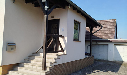 Well-maintained detached house with outbuilding and heated pool