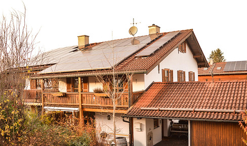 Semi-detached house with a garage, carport, and solar panel system, located in a quiet area of Königsdorf.
