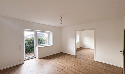 Moderne Hochparterre Terrassenwohnung mit eigenem Garten –  Hochwertig energetisch saniert