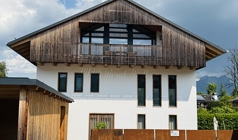 Modern townhouse with a garden area, located in a family-friendly neighborhood in Brannenburg.