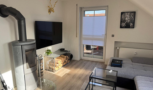 5-room maisonette apartment with fireplace, garden and garage in Untermeitingen - ready to move in!