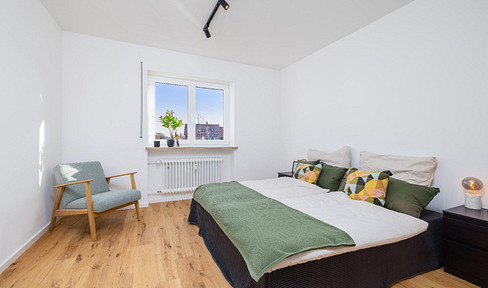 Sofort bezugsfertige, sanierte Wohnung mit Westbalkon und zwei Tiefgaragenstellplätzen