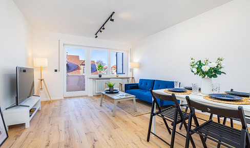 Refurbished apartment ready for immediate occupancy with west-facing balcony and two underground parking spaces