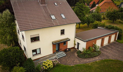 Well-kept two-family house with high-quality furnishings and park-like garden