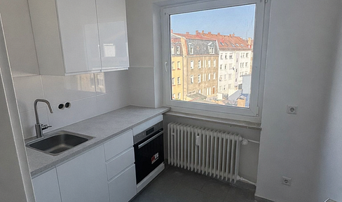 Renovated one-bedroom apartment with balcony.