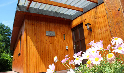 High-quality Chalet-style house in a peaceful, green setting.