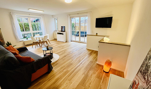 2 Zimmer + Hobbyraum: Gartenwohnung mit 105 qm Wohn-Nutzfläche & Sauna