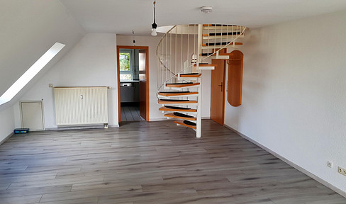 Bright 2.5-room maisonette apartment, including a parking space and a second storage room, located in Kirchberg.