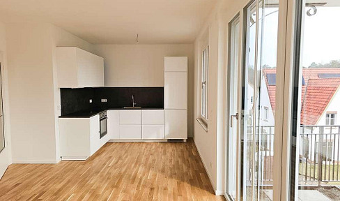 New construction: 3-room apartment with underfloor heating, fitted kitchen, balcony, and underground parking.