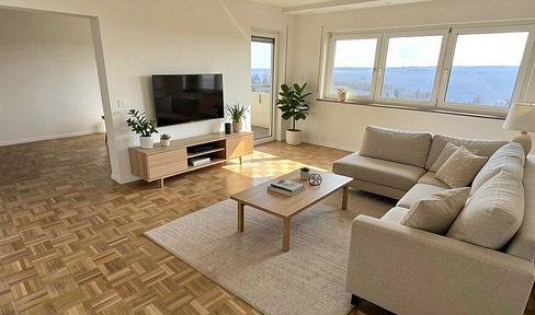 Newly renovated 4-room apartment with a south-facing balcony and a stunning panoramic view over the Blautal valley.