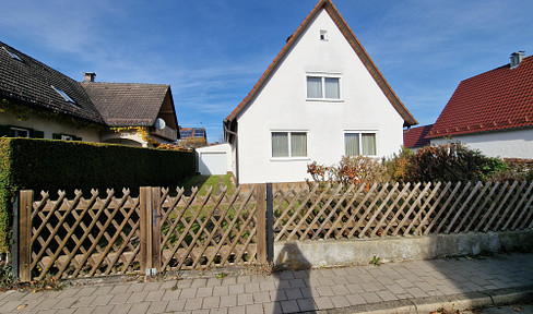 Property with an older building in need of renovation.