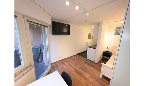 Fully furnished designer apartment with a balcony and underground parking space, in a prime location in Mannheim (L7 district), directly next to the university.