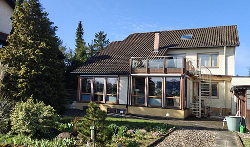 Multi-family house with a large plot of land.