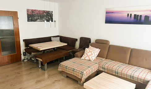 Tastefully renovated 3-room apartment with a balcony, parking space, and fitted kitchen, located in Augsburg-Lechhausen.