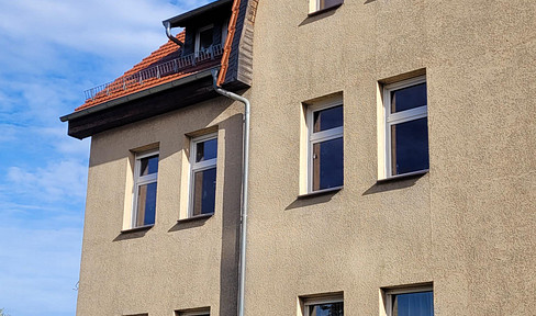 Accessible living in a two-family house with an elevator, garden, and parking spaces.