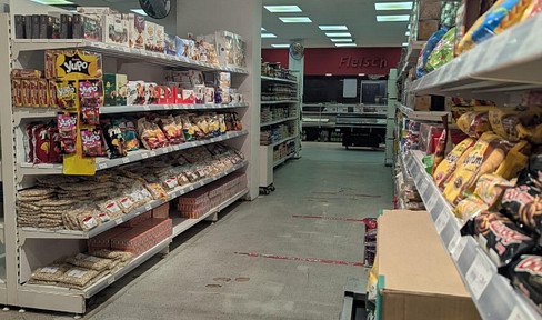 Grocery store with a fresh meat counter, located near the Dortmund harbor.