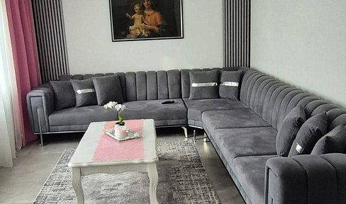 Modernized 4.5-room apartment (103 m²) with a balcony, garage, and an additional 18 m² home office space.