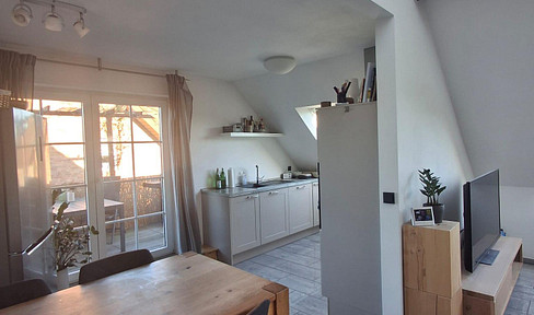 High-quality, very bright apartment with a rooftop terrace, balcony, garage, and two private parking spaces in Xanten.