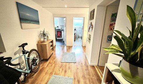 Charming apartment in the basement level, featuring a renovated bathroom with marble tiles.