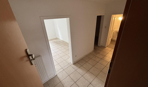 2-room basement apartment with a view of greenery.