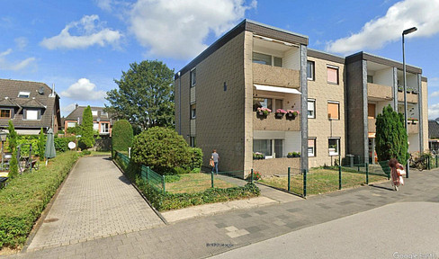 Charming and bright 2-room apartment with balcony and garage.