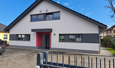 Modern apartment in a semi-detached house with a terrace, garden, and parking spaces in Rathenow.