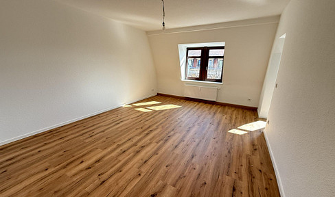 Bright and spacious 3-room attic apartment in a historic building – newly renovated with 69 square meters of living space.
