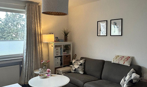 Bright, one-room apartment with fitted kitchen, featuring a modernised living and kitchen area.