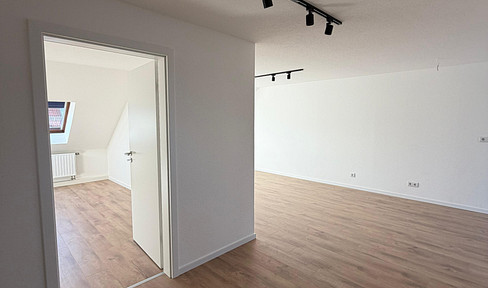 Renovated 2-room apartment with fitted kitchen, offering a view over the rooftops of Leipzig.