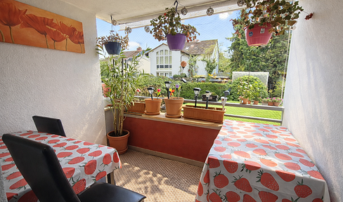 Charming 3-room ground floor apartment with a balcony, fitted kitchen, and underground parking garage, located in a central area of Kelkheim.