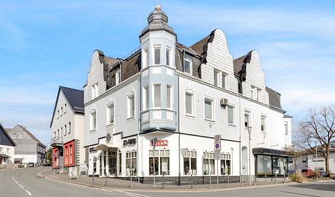 A renovated residential and commercial building that is a prominent feature of the townscape, located in the heart of Halver.