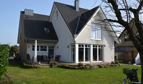 Modernized family home with a large southwest-facing garden, solar panels, and a heat pump.