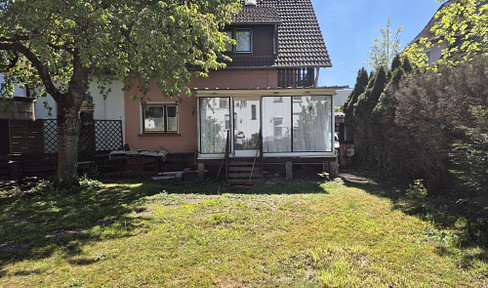 Detached house with garden, conservatory, and garage, offering significant potential.