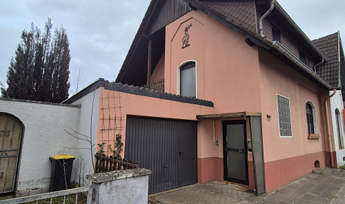 Partially renovated house with great potential for a small family.