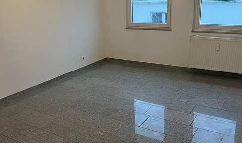 2-room attic apartment, bright and cheerful, modern, renovated, centrally located, with a garage.