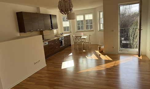 Modern 2-room maisonette apartment with a private garden.