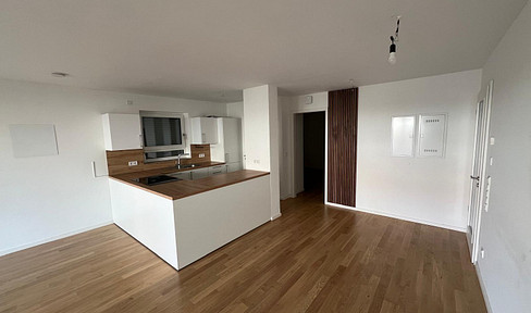 Modern 3-room apartment with a terrace and a share of the garden.