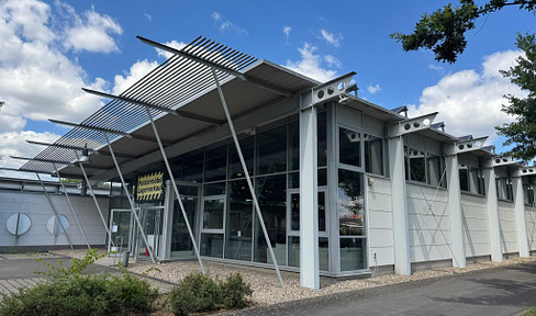 Glass-walled, transparent industrial building.