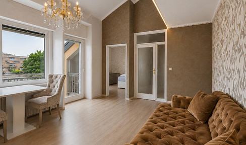 Quiet 3-room apartment with high ceilings, a balcony, and underground parking, located in a green area.