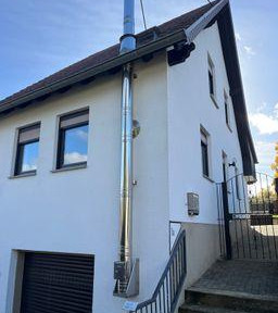 Detached house for sale, with only one side attached to another building.