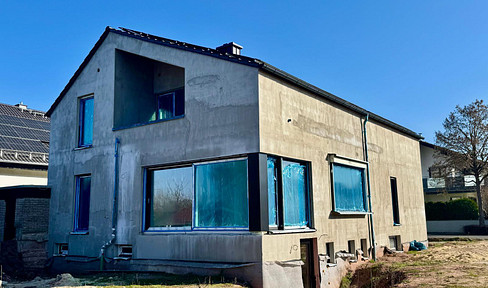 Two-family house (KfW55 standard) with design options.