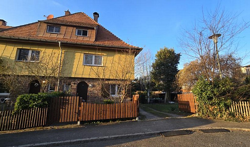 Charming terraced house with a garden, located in a quiet residential area.