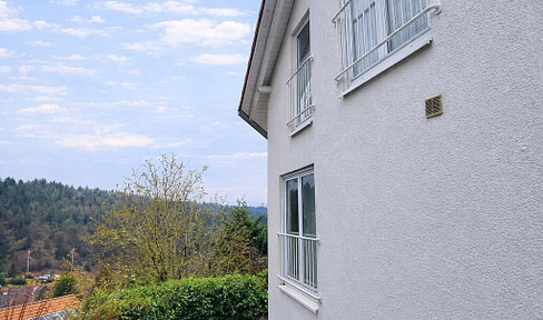 Attractive semi-detached house in a sunny, hillside location with views of the surrounding greenery.